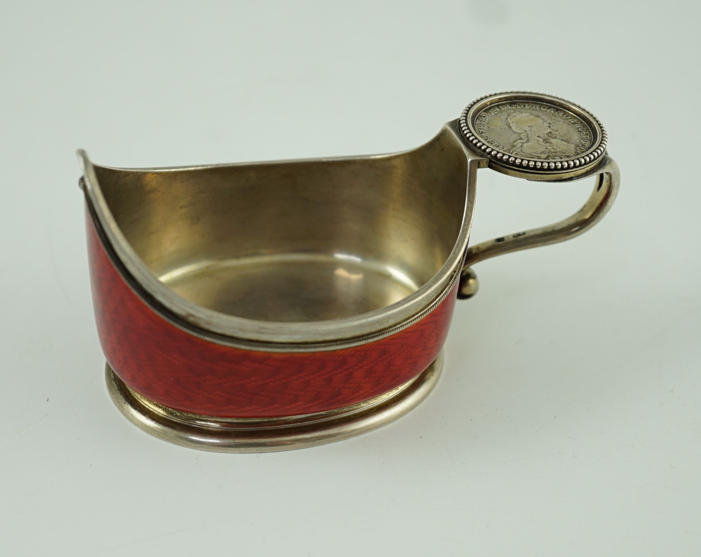 CARL FABERGE: A late 19th/early 20th century 88 zolotnik and red guilloche enamel oval kovsh, work master Anders Johan Nevalainen